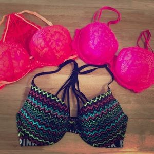 Three pink Victoria’s Secret bras.